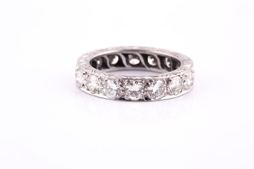 Lot 418 - A diamond and platinum full eternity ring, set...