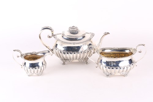 Lot 792 - A George III three-piece silver teaset, London...