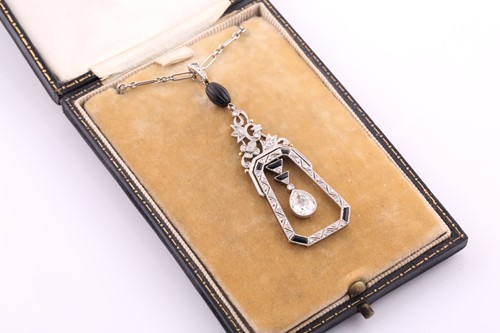 Lot 429 - An Art Deco diamond and onyx drop pendant, the...