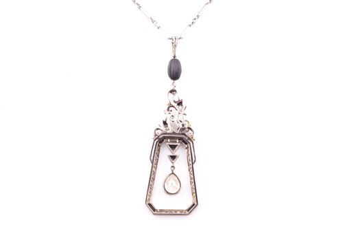 Lot 429 - An Art Deco diamond and onyx drop pendant, the...