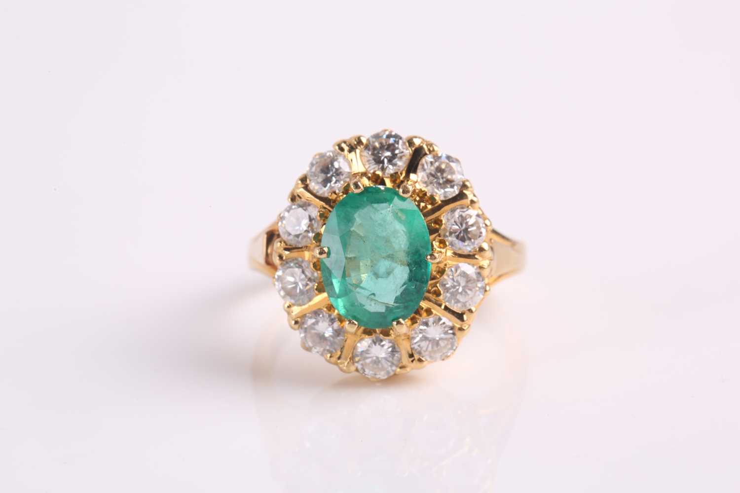 Lot 286 - An 18ct yellow gold, emerald and diamond...