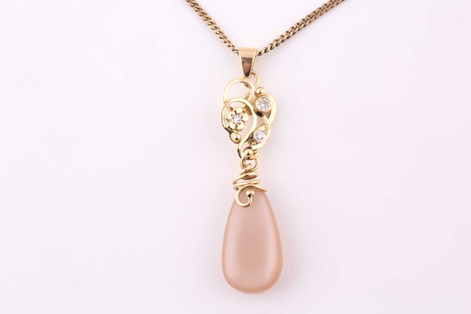 Lot 4 - A diamond and pear shape moonstone pendant, on...