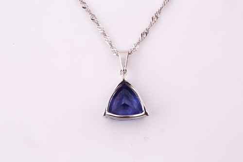 Lot 253 - A tanzanite and diamond pendant, the...