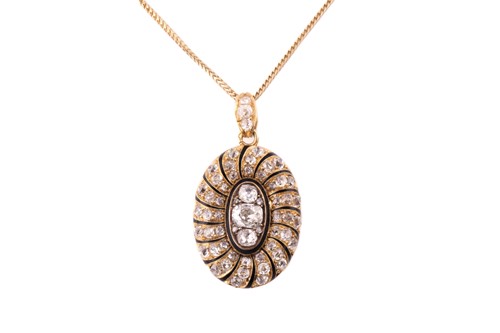 Lot 24 - A late 19th century French oval locket/pendant,...