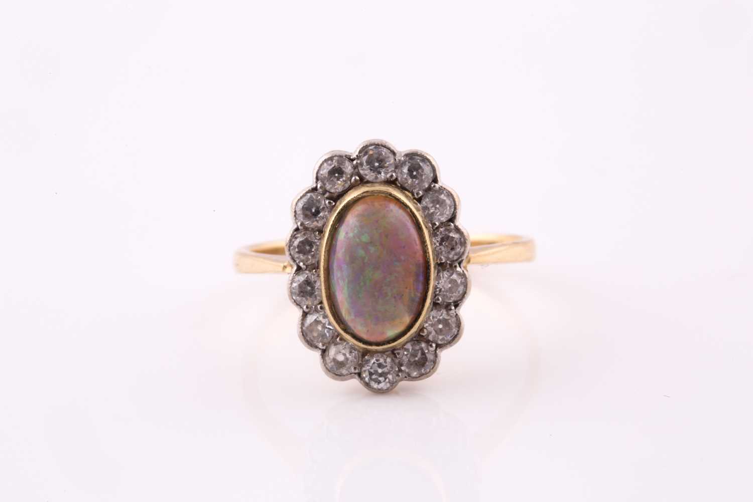 Lot 94 - An opal and diamond cluster ring, opal...