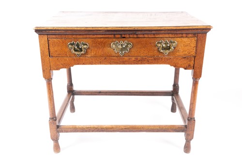 Lot 223 - An early 18th-century oak single drawer lowboy,...