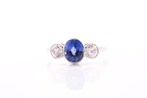 Lot 380 - A platinum, diamond, and sapphire ring, collet-...