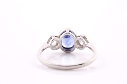 Lot 380 - A platinum, diamond, and sapphire ring, collet-...