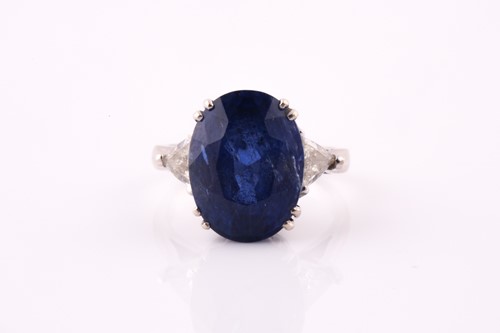 Lot 411 - A sapphire and diamond three stone ring, the...
