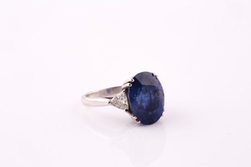 Lot 411 - A sapphire and diamond three stone ring, the...