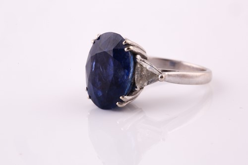 Lot 411 - A sapphire and diamond three stone ring, the...