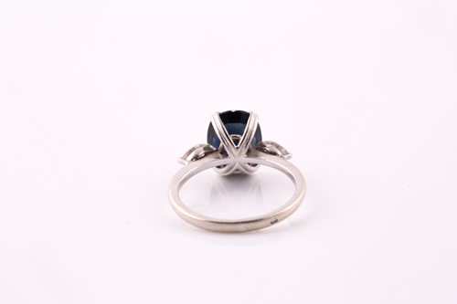 Lot 141 - A sapphire and diamond three stone ring, with...