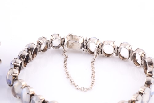 Lot 90 - A silver and moonstone bracelet, set with oval...