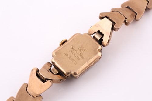 Lot 19 - A gold plated cocktail watch; the square...