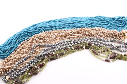 Lot 193 - A multi-strand turquoise colour bead necklace...