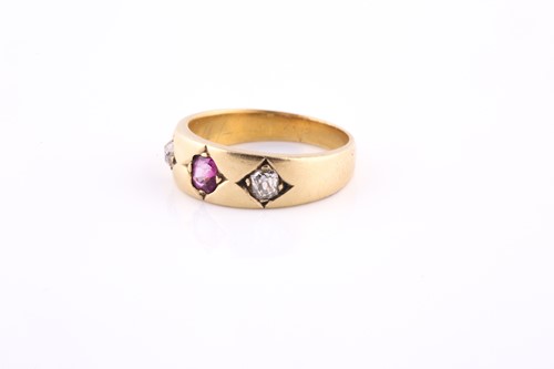 Lot 276 - An 18ct yellow gold, diamond, and ruby ring,...