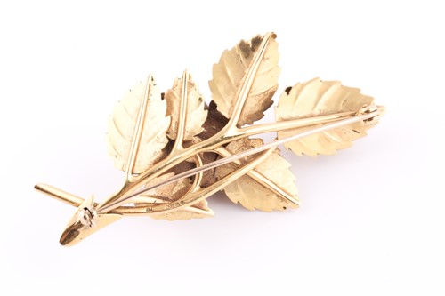Lot 10 - An 18ct yellow gold floral spray brooch, in...