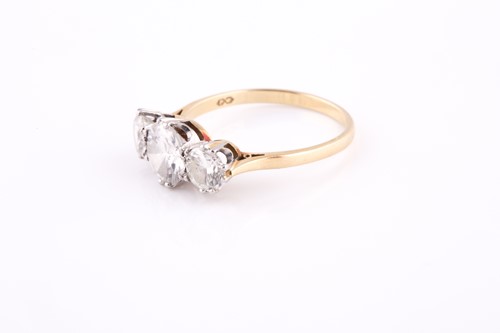 Lot 213 - An 18ct yellow gold and diamond trilogy ring,...