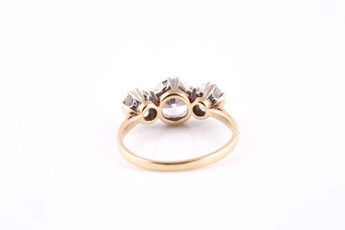 Lot 213 - An 18ct yellow gold and diamond trilogy ring,...