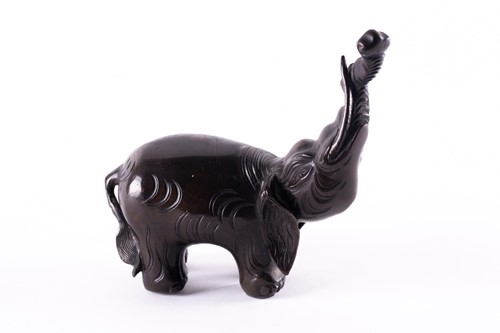 Lot 112 - A Chinese patinated bronze elephant figure of...