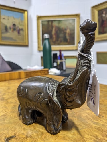 Lot 112 - A Chinese patinated bronze elephant figure of...