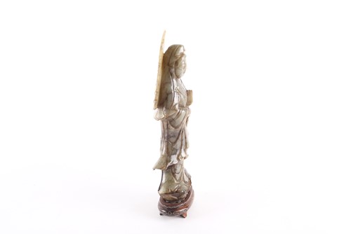 Lot 96 - A carved soapstone figure of Guanyin, on an...