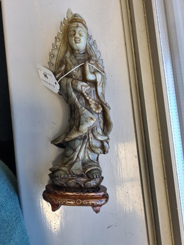 Lot 96 - A carved soapstone figure of Guanyin, on an...