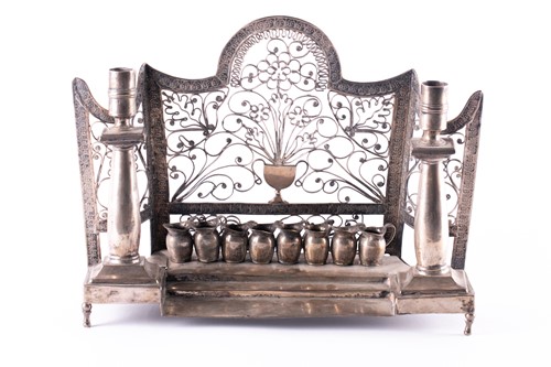 Lot 788 - An antique white metal menorah, possibly...