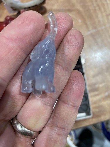 Lot 163 - A Chinese Jade amulet, carved and pierced with...