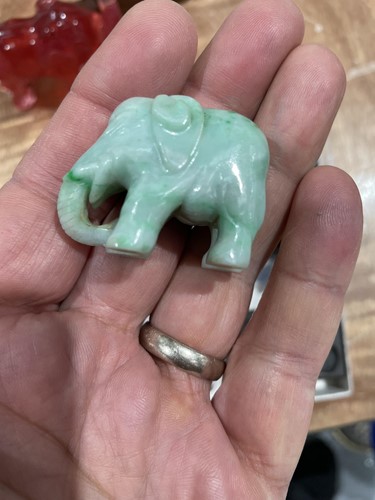 Lot 163 - A Chinese Jade amulet, carved and pierced with...