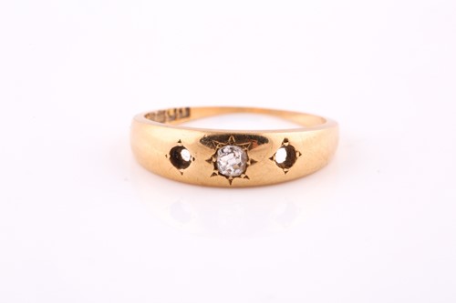 Lot 600 - An 18 carat yellow gold gypsy set diamond ring....