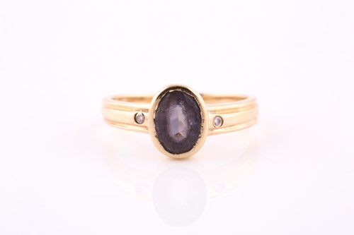 Lot 648 - A single stone sapphire ring; the oval cut...