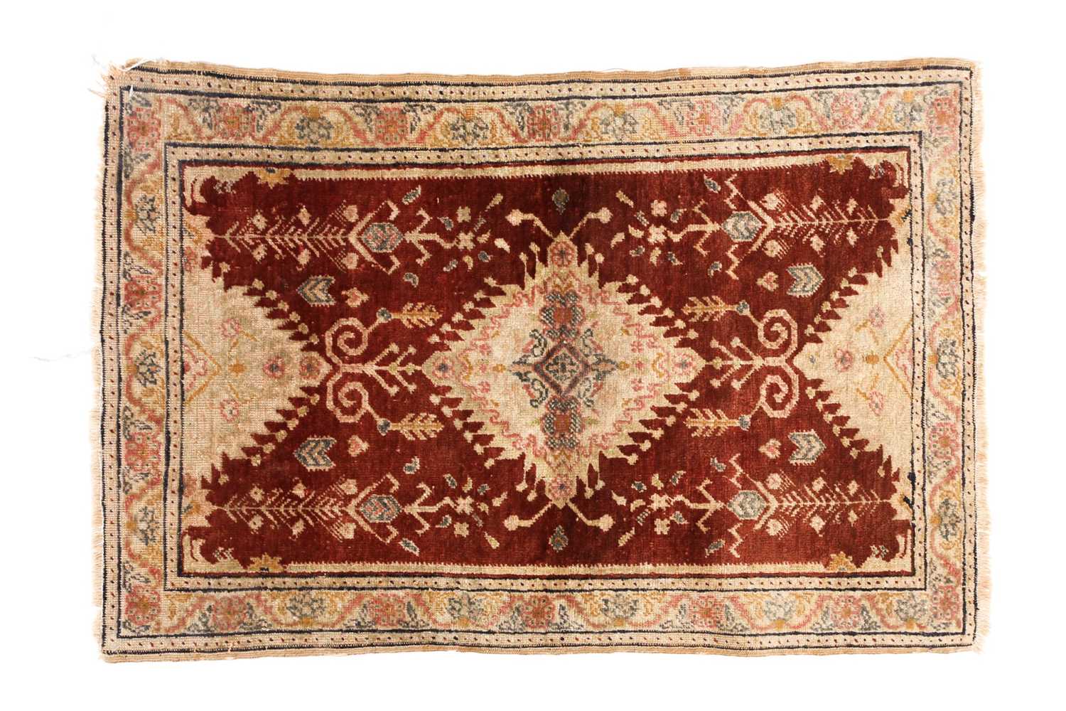 Lot 128 - An antique Turkish rust-red ground silk mat...