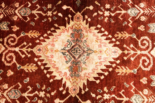 Lot 128 - An antique Turkish rust-red ground silk mat...