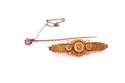 Lot 699 - A single stone ruby stick pin the claw mounted...