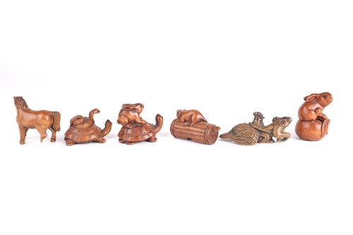 Lot 79 - A group of six Japanese hardwood carved...