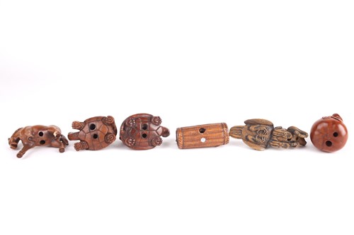 Lot 79 - A group of six Japanese hardwood carved...