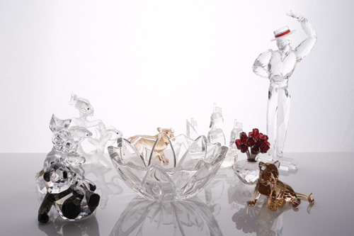 Lot 360 - A collection of boxed Swarovski crystal items,...