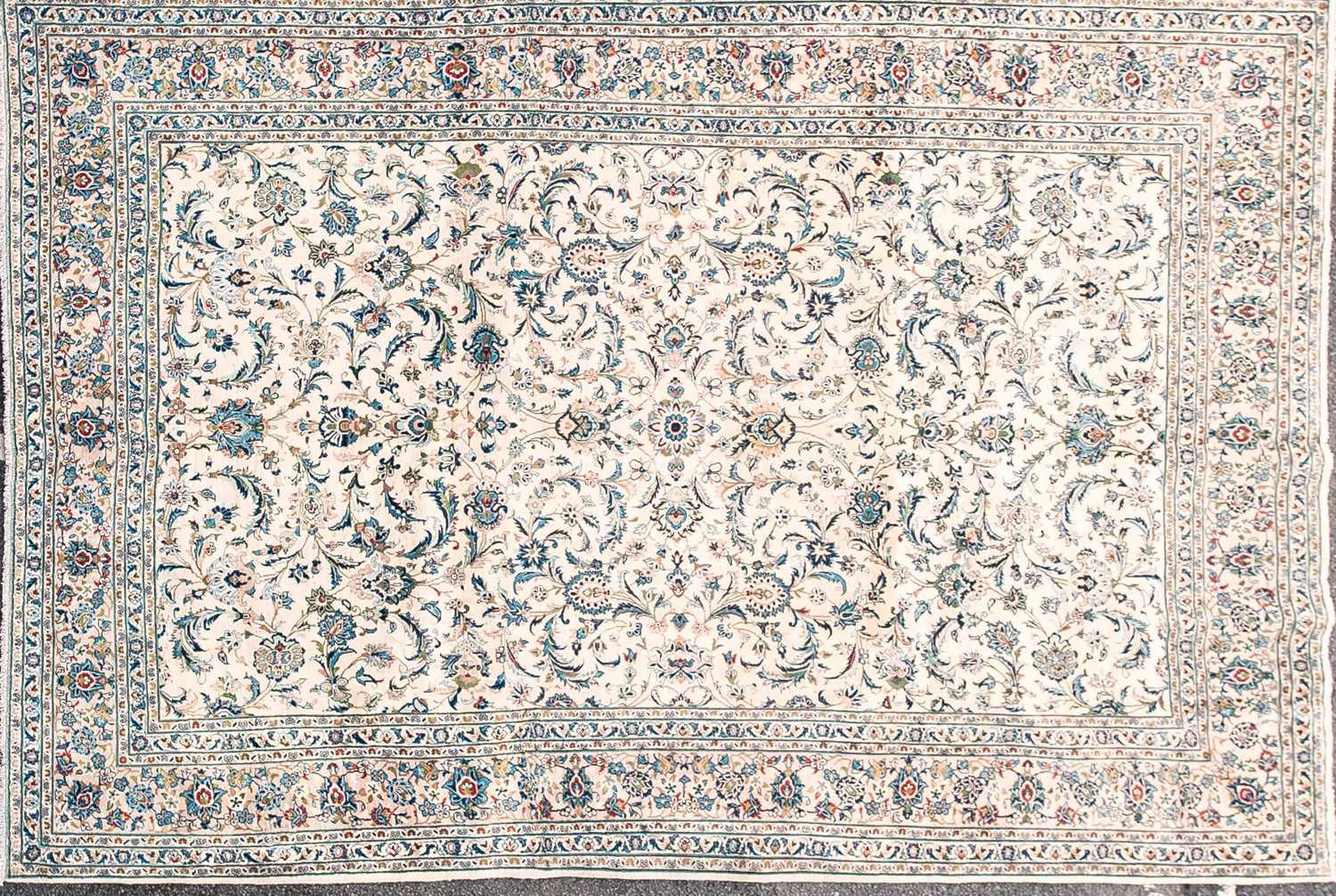 Lot 188 - A 20th-century ivory ground Kashan carpet with...
