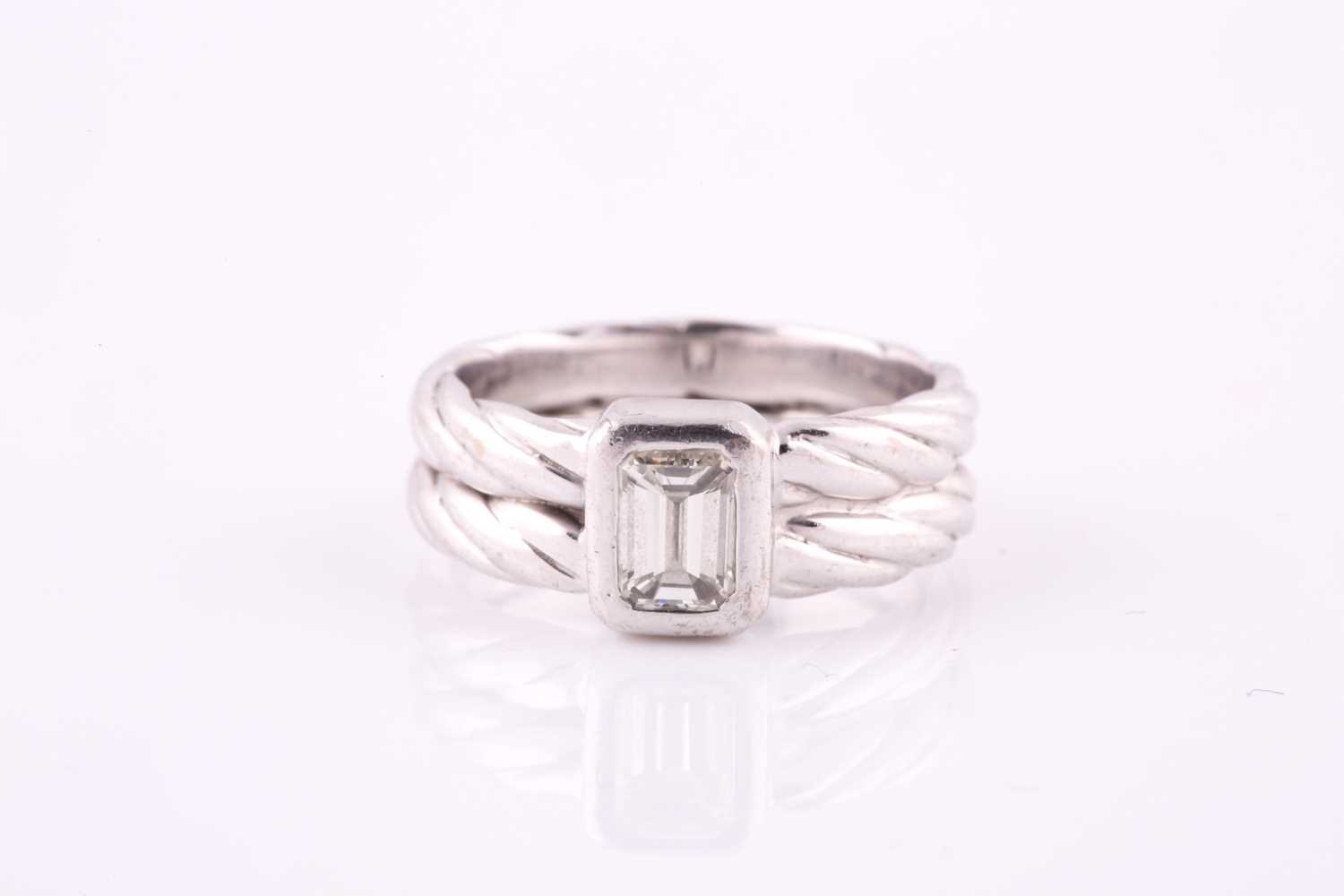 Lot 147 - A diamond single-stone ring The collet-set...