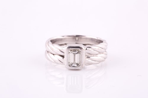 Lot 147 - A diamond single-stone ring The collet-set...