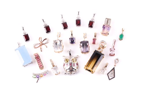 Lot 365 - A collection of gem-set pendants Each set with...