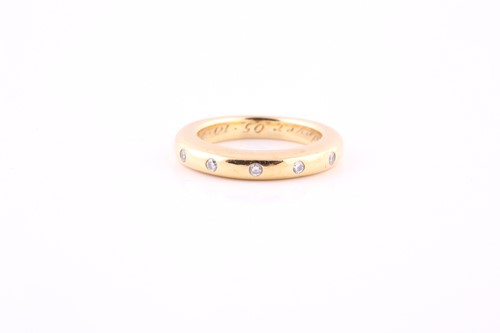 Lot 558 - A diamond five-stone ring The polished band...