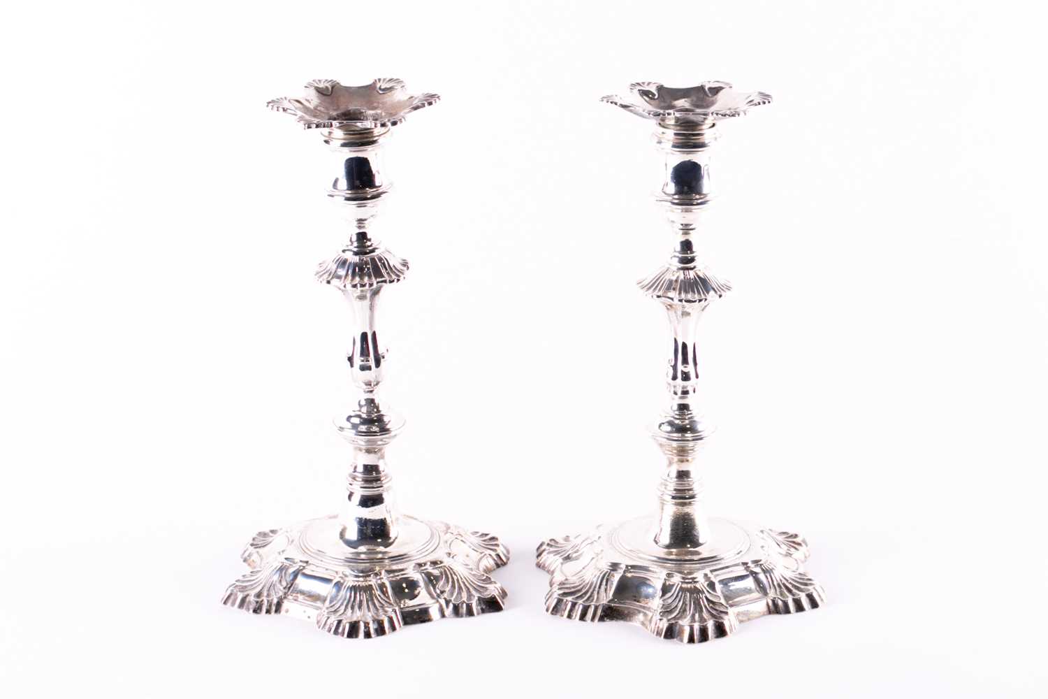 Lot 814 - A matched pair of George II hollow cast silver...