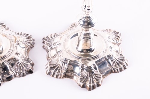 Lot 814 - A matched pair of George II hollow cast silver...