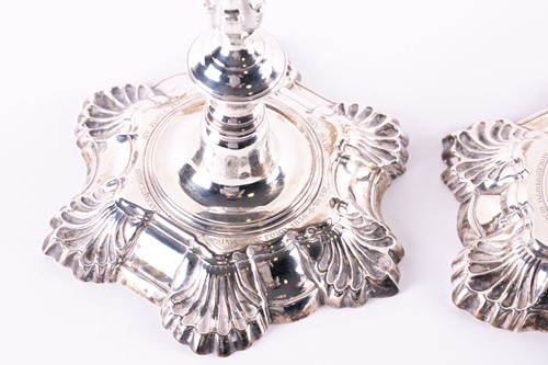 Lot 814 - A matched pair of George II hollow cast silver...