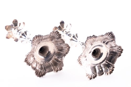 Lot 814 - A matched pair of George II hollow cast silver...