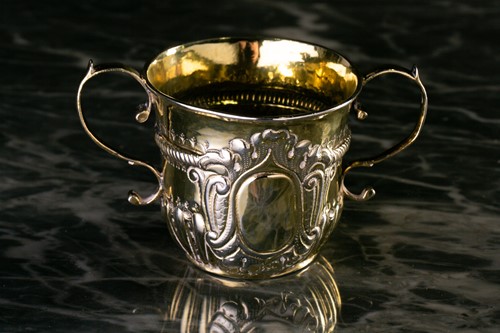 Lot 778 - A George I silver-gilt porringer, London 1719...