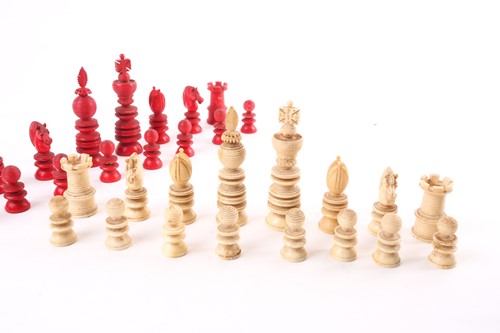 Lot 271 - A late 19th century stained ivory chess set,...