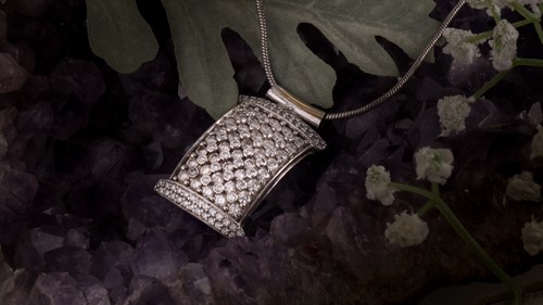 Lot 382 - A diamond pendant necklace The snake-link...